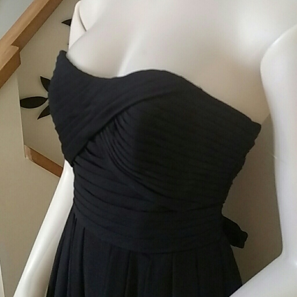 Black flowing strapless gown